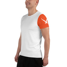 Load image into Gallery viewer, Side view of a man wearing the Technical Trainer Swivel Bottle shirt. The shirt features an orange left sleeve with the brand's logo.