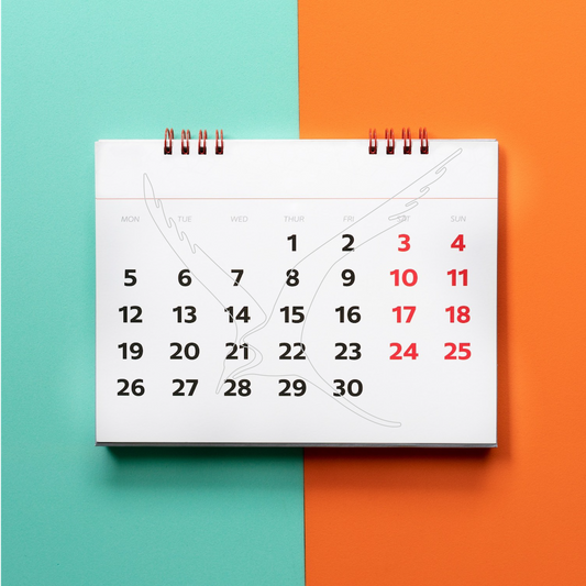 Image of calendar on orange and teal background.