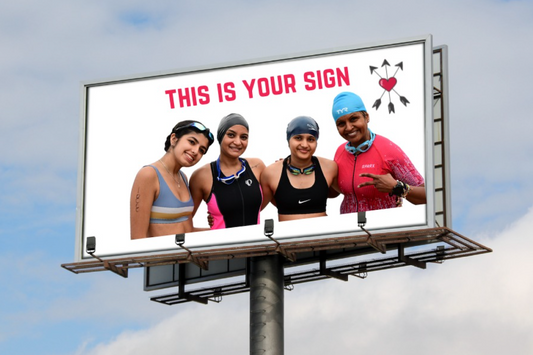 sign with 4 female triathletes