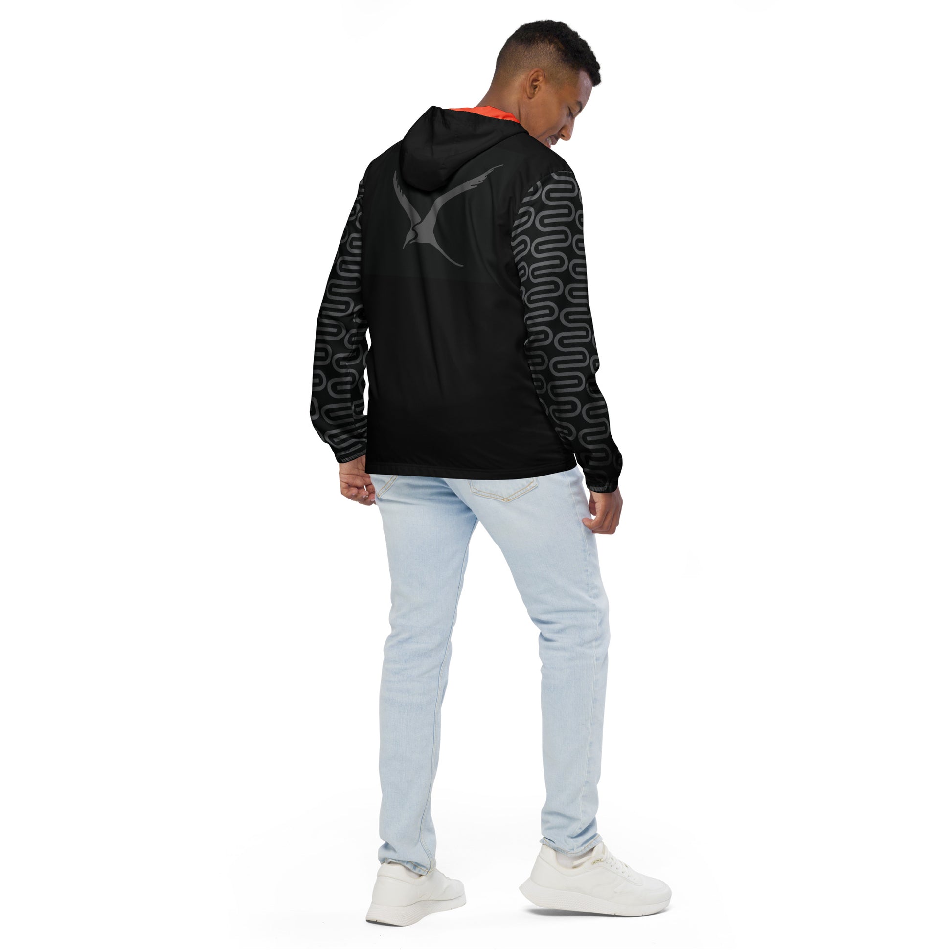 Back view of a man wearing the Swivel Bottle windbreaker in black.