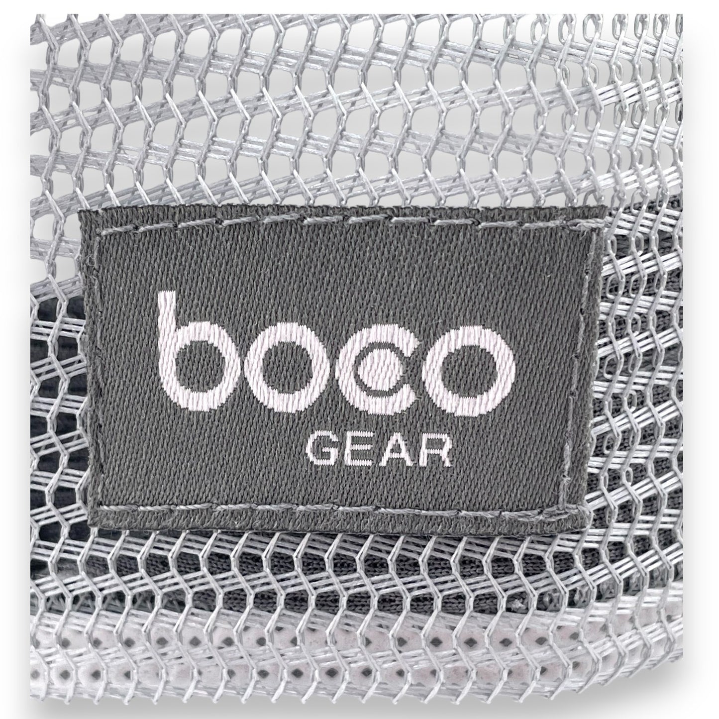 Close-up view of the Swivel Bottle Technical Trucker hat, zoomed-in on the boco gear patch