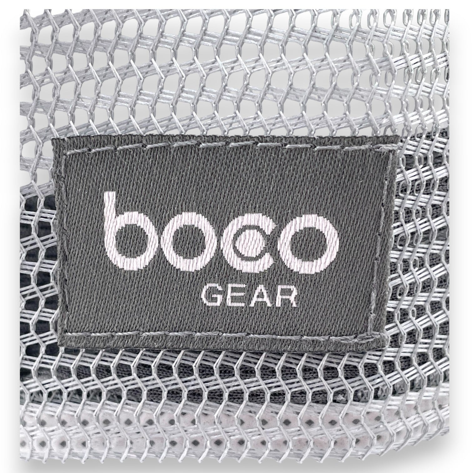 Close-up view of the Swivel Bottle Technical Trucker hat, zoomed-in on the boco gear patch